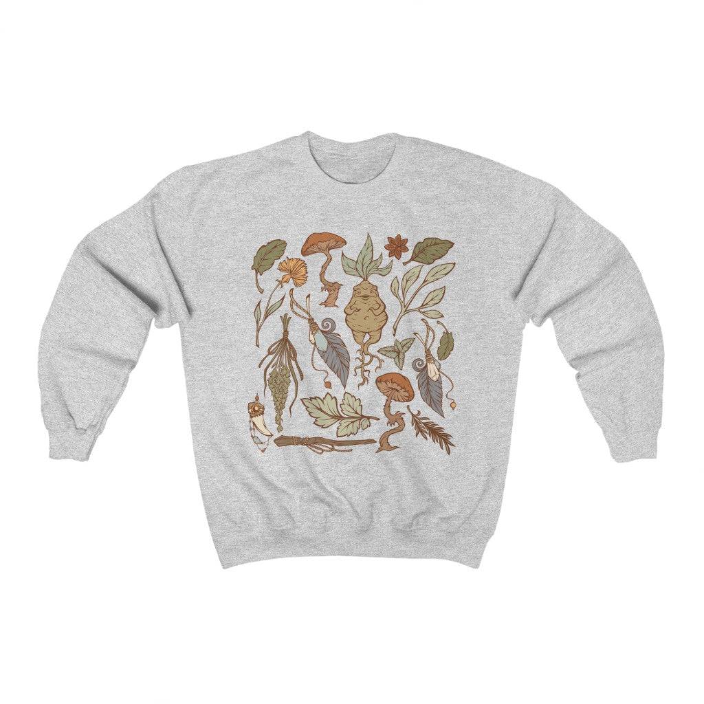 Perfect for the green witch or botany lover. This oversized witchy crewneck sweatshirt features beautiful botanical art. The perfect addition to any witch aesthetic wardrobe.
