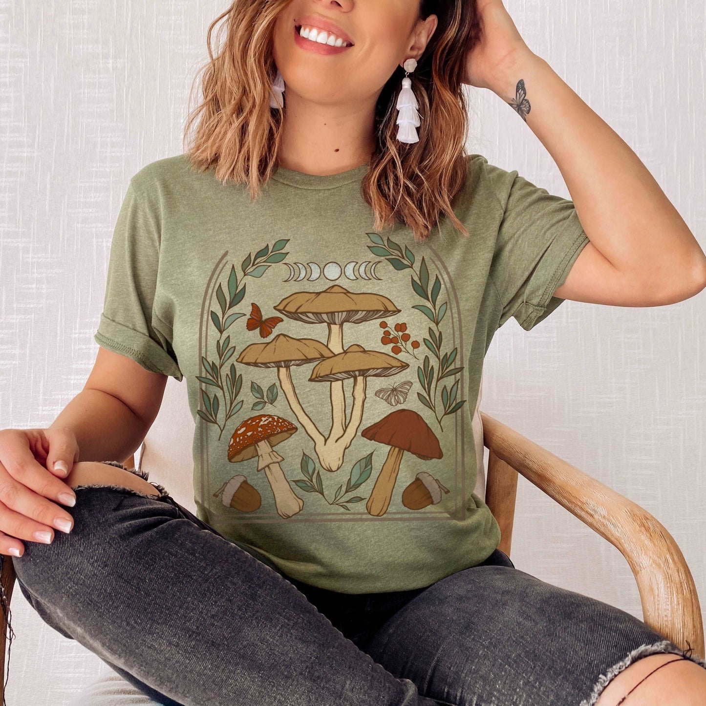 Perfect for the green witch or botany lover. This oversized witchy crewneck shirt features beautiful mushroom moon art. The perfect addition to any witch aesthetic wardrobe.